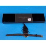 An originally cased lady's Yves Saint Laurent Collection wristwatch on original woven strap, gilt