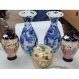 A Japanese pair of Imari vases, 21 cm; a pair of satsuma vases, 15 cm; another piece