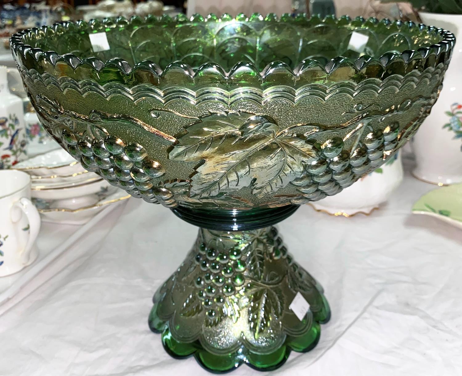 An impressive Carnival Glass table centre green fruit bowl, molded fruiting vine decoration,