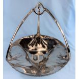 A silvered pewter Art Nouveau cake dish with triform handle, stamped Urania, height 22 cm
