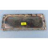 A rectangular planished Swedish white metal tray with floral embossed border, 3 crowns mark