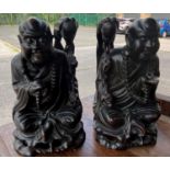 Two Chinese carved hardwood figures of seated sages height 25cm