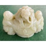 A Chinese jade coloured hardstone group of a young girl and boy with central basket of flowers