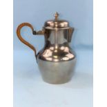 A small continental white metal covered jug with woven cane covered handle, 5.75oz, 180gm