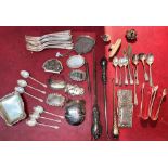 A mixed selection of silver plated and white metal items including button hooks, decanter labels etc