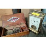 A vintage German 8-day carriage clock and a set of cased apothecary's scales