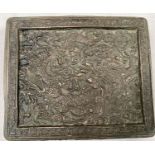 A Chinese bronze small rectangular table stand with dragons decorated in relief, 10.5cm x 9cm