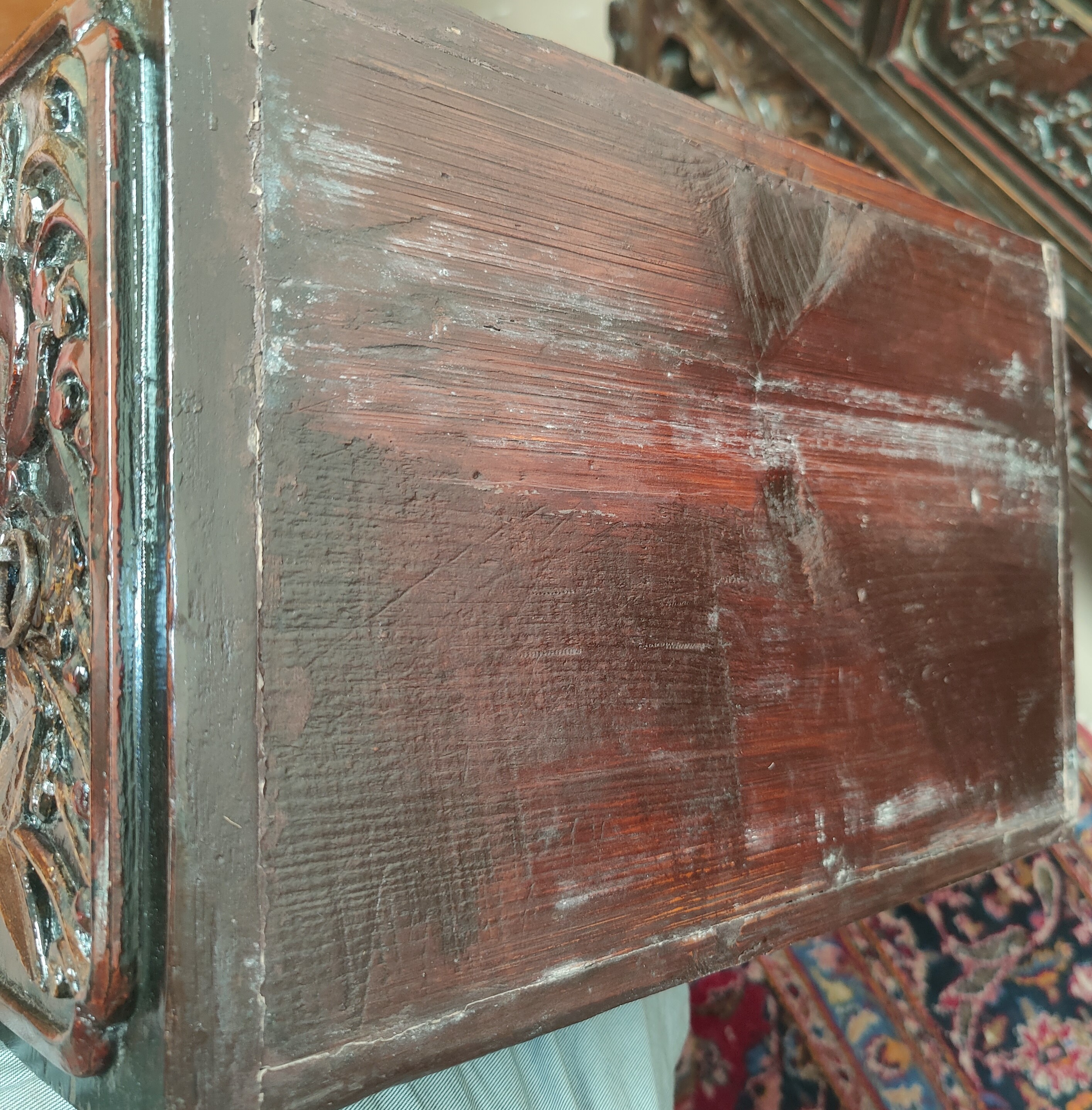 A late 19th/early 20th century Chinese unusual altar table, carved and lacquered with scroll end - Image 9 of 9