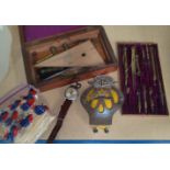 A 19th century geometry set in a mahogany box; a vintage motor car AA badge; a selection of Kensitas