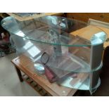 A glass 3-tier TV stand