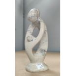 A Stoneware sculpture in the manor of Henry Moore, parent and child height 10cm
