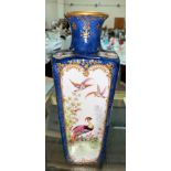 A Sevres style handpainted porcelain vase with blue background, polychrome panels of birds and