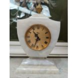 An Imhoff marble effect cased mantel clock with Swiss level escarpment movement