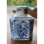 A Chinese blue and white canted squared lidded tea caddy with floral decoration, height 12cm