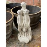 A reconstituted stone group of meerkats height 66cm