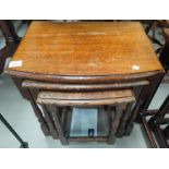 An oak nest of three occasional tables