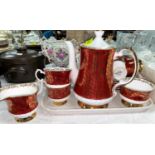 An Elizabethan red and gilt part tea set; a Poole vase; a pair of encrusted sleigh vases in the
