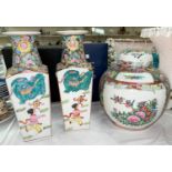 A Chinese pair of porcelain vases of tapering form, square section, decorated in colour enamels;