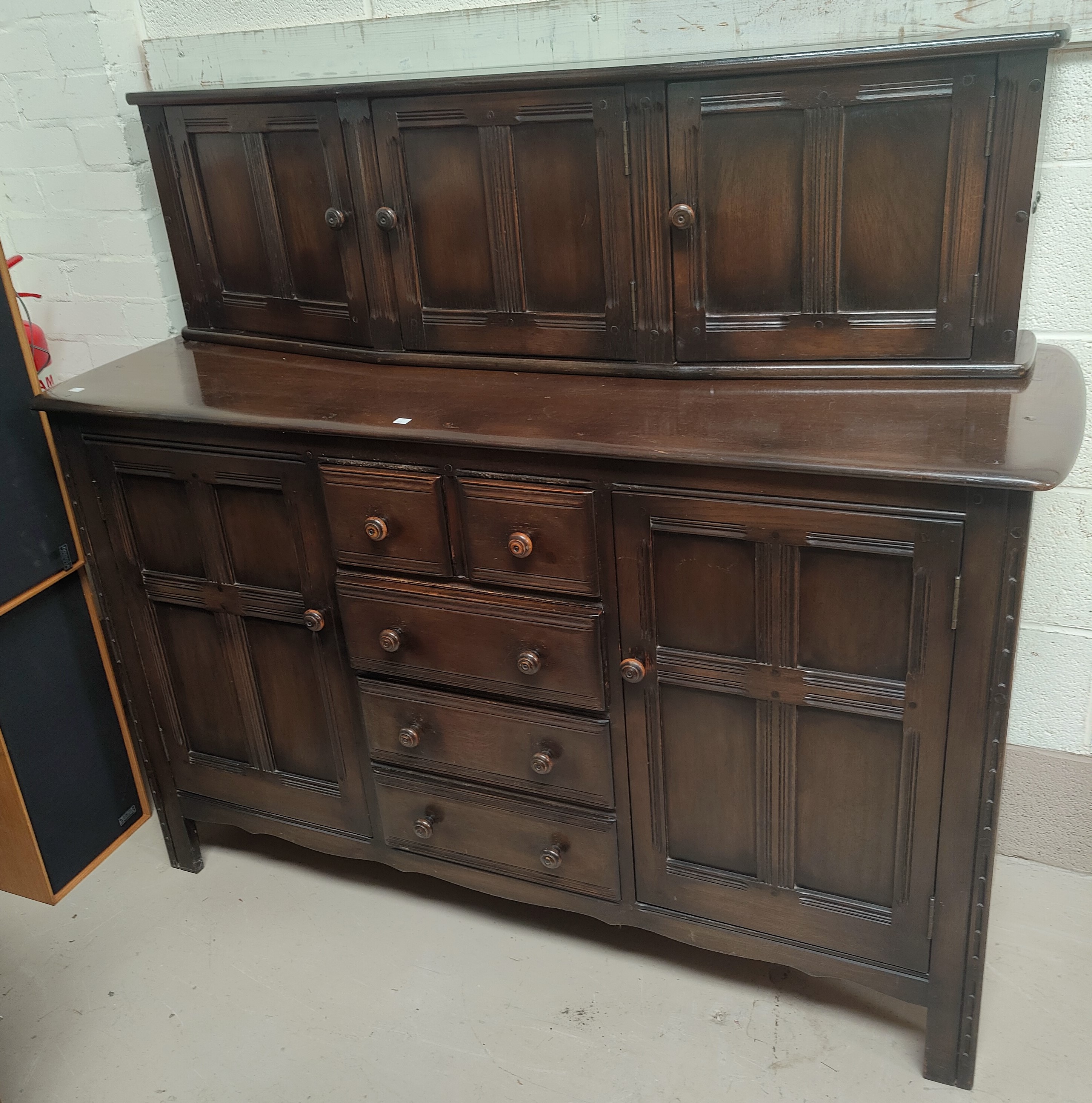 An Ercol traditional style dining suite comprising sideboard, 145 cm, 4 chairs with panelled backs