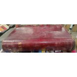 A very large red leather bound 19th century ledger dating from 1863 all with local people and