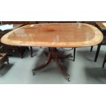 A late 19 / early 20th century Regency style tilt top supper table with wide satin banding, the base