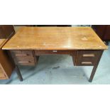 A large vintage oak W.H.Priest and Sons teachers desk with rectangular rounded top, three drawers on