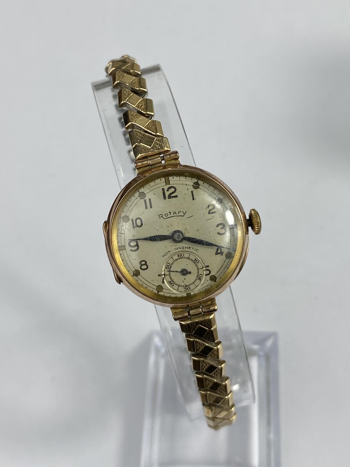 A lady's 9 carat wristwatch with import marks for Glasgow 191, on Excalibur gold plated expanding