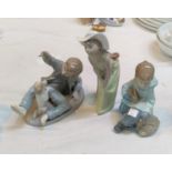 Two Nao figures, boy with dog & boy with rabbit; a Lladro figure, girl in hat