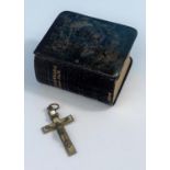 A miniature book of Common Prayer with hallmarked silver cover with angels in relief and a