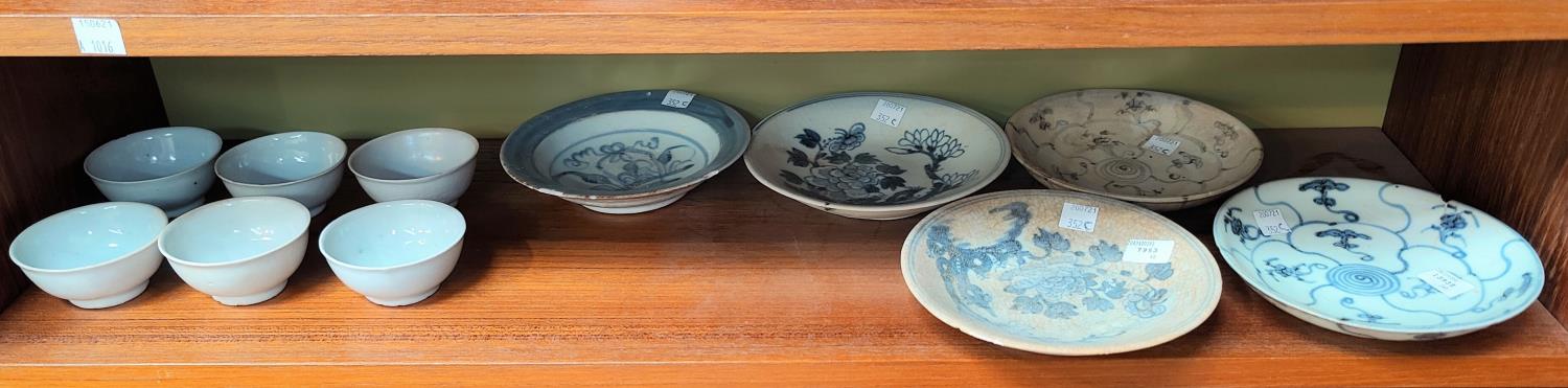 Six Chinese Tek Sing Cargo tea bowls and five smaller dishes