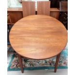 A 1960's teak dining suite comprising of extending G-Plan dining table, 2 leaves extending to