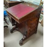 An early 19th century brr walnut Davenport desk with hinged slope front writing surface and 5 side