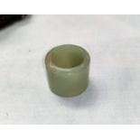 A Chinese jade coloured hard stone archers ring
