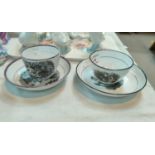 An early 19th century bat printed tea bowl and saucer; a similar tea cup and saucer with