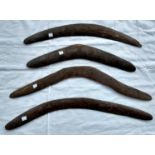 Four Aboriginal tribal carved boomerangs, one with carved patternation, longest 62cm, shortest 49.