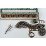A silver gilt filigree bracelet set amethyst coloured cabochon stones; costume jewellery