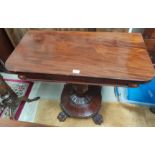 A rounded rectangular William IV period mahogany fold over tea table on octagonal baluster column