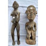 Two carved wood African tribal figures of a woman height 46cm and 39cm