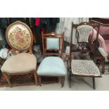 An Edwardian inlaid rosewood nursing chair in light blue; an Edwardian stained mahogany folding