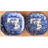 A pair of Japanese blue and white squared dishes decoarted with mountain scenes, length 17cm