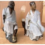 Two Chinese Shiwan figures of seated men (both with areas of damage)
