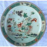 A Chinese famille verte charger decorated with plants and insects, diameter 33cm