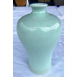 A Chinese celadon glaze inverted baluster vase , height 18cm