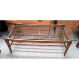A 1960's rectangular coffee table with glass top