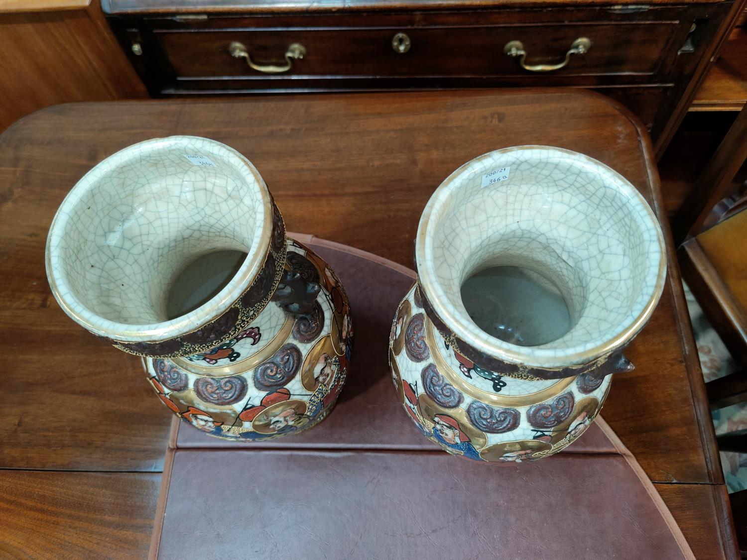 A pair of oriental crackle glaze vases decorated with men with gilt haloes holding lanterns, - Image 2 of 3
