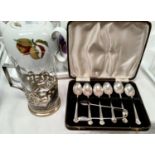 A set of six cased teaspoons, Sheffield 1940; a pair of hallmarked silver sugar tongs, Sheffield