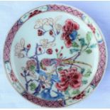A small Chinese famille rose dish with polychrome decoration of a bird on a branch surrounded by