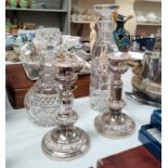 A 19th century pair of telescopic candlesticks in ornate Sheffield plate; 2 glass decanters