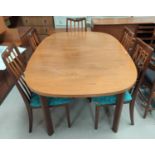A G-Plan teak dining suite comprising extending table with rounded rectangular top and 6 chairs