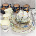 A 1930's floral tea set by Foley, 19 pieces; a Quimper part tea set, 11 pieces; etc.